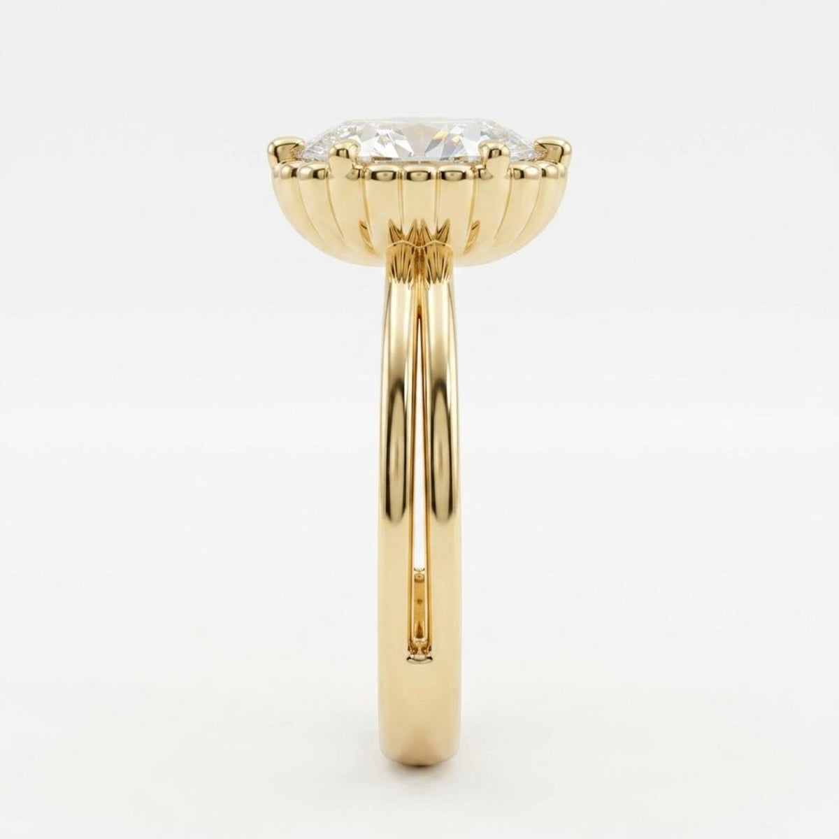 Side profile view displaying the fluted scalloped setting and split double band of a yellow gold oval engagement ring.