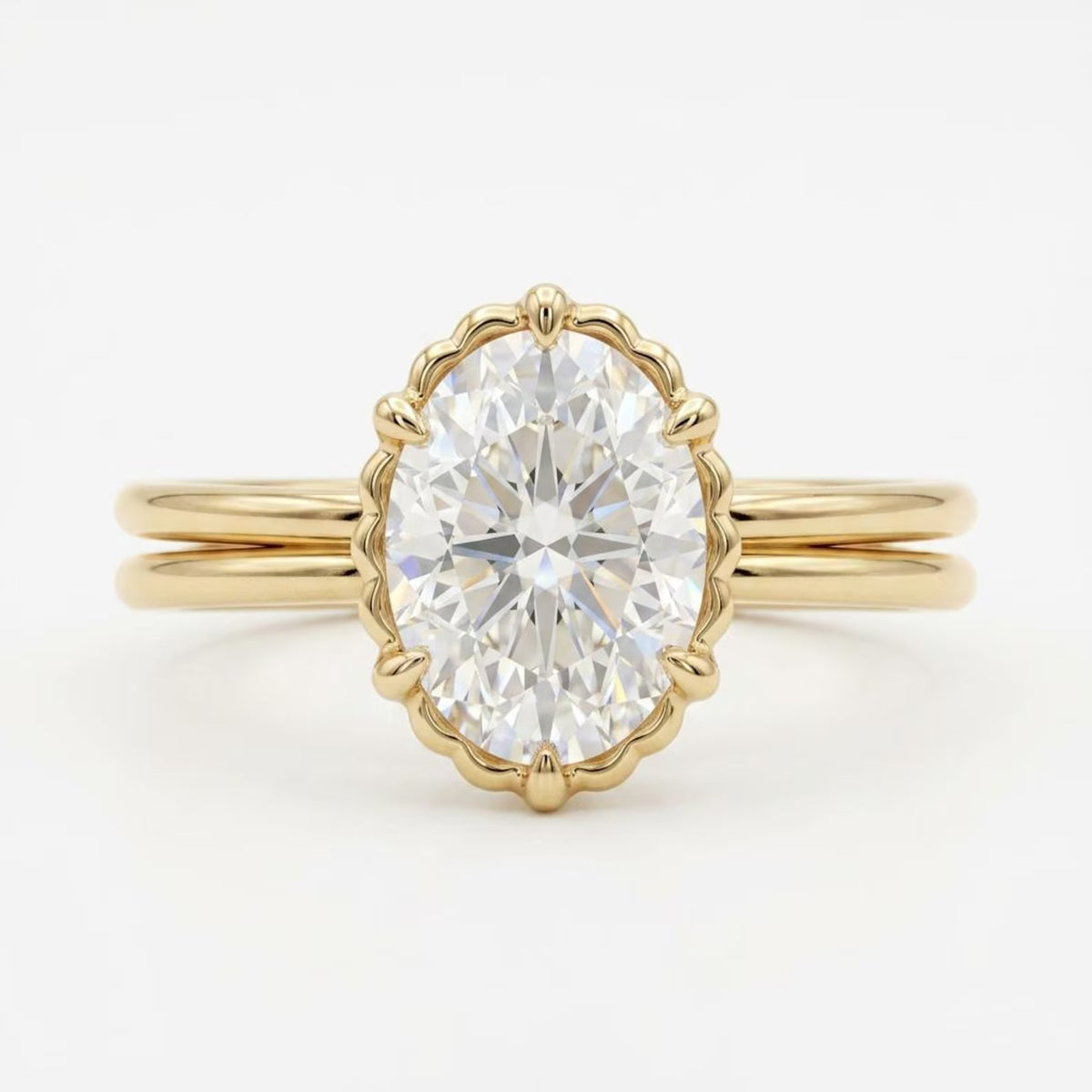 Top-down view of a 3 CT oval cut lab grown diamond engagement ring framed by a scalloped bezel on a yellow gold double band.