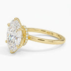Angled view of a 4 CT marquise cut lab diamond engagement ring featuring a 6-prong setting and hidden halo in yellow gold