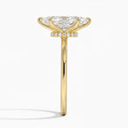 Direct side view showing the thin yellow gold band and pavé diamond hidden halo under a 4 CT marquise cut lab diamond