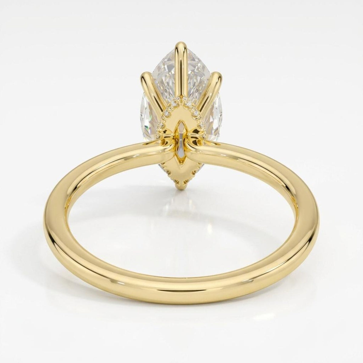 Underside gallery view of a yellow gold 6-prong setting for a 4 CT marquise cut lab grown diamond ring with hidden halo