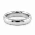 Studio product shot of a men's platinum milgrain edge wedding ring isolated on a clean white background