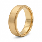 Angled studio view of a men's yellow gold wedding band with satin center and diamond-cut edges.