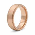 Angled view of a men's rose gold wedding band showing high-polish interior and knurled edges