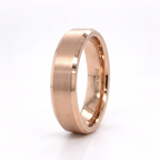 Studio shot of a 14K rose gold men's wedding ring showcasing internal quality stamp and brushed exterior.