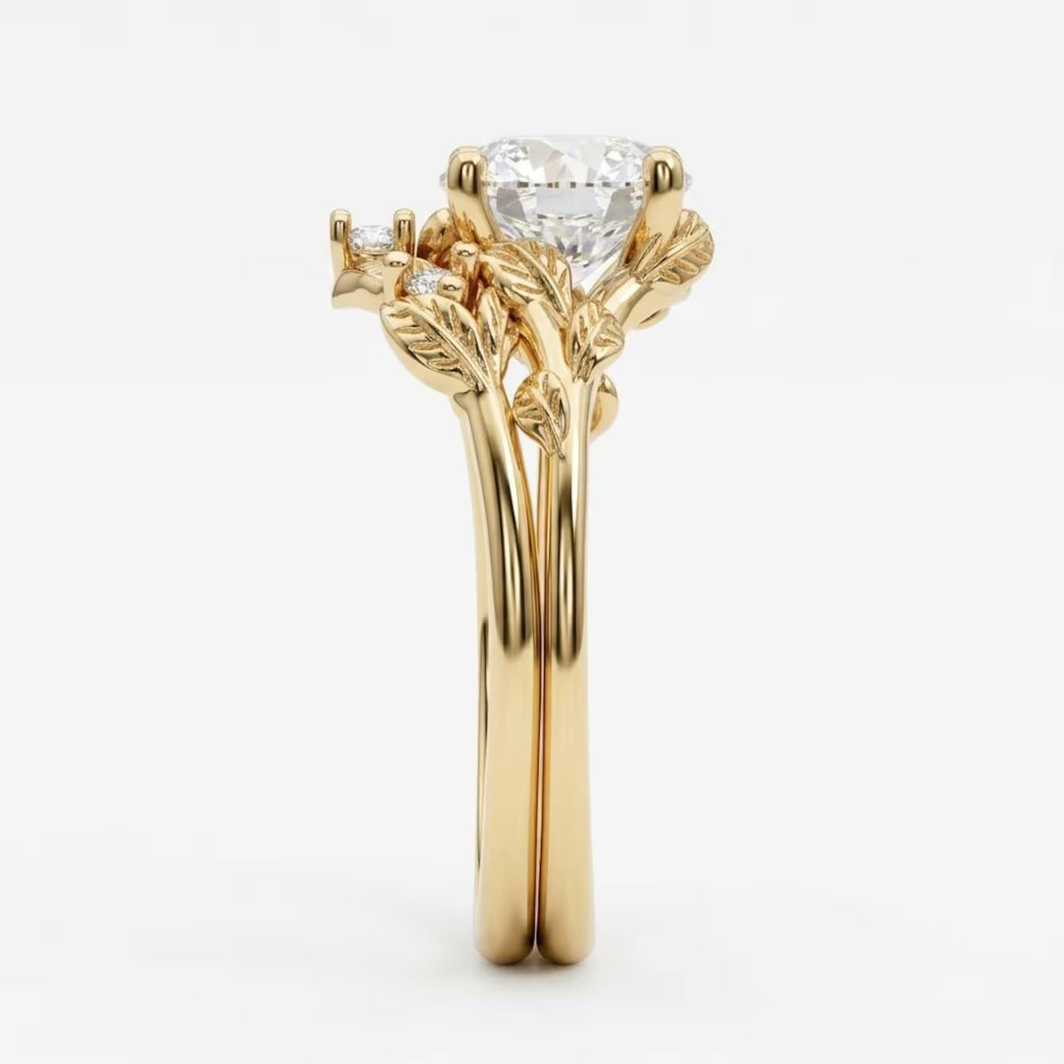 Side profile of a 3 carat round cut lab grown diamond ring with 14k yellow gold leaf prongs and matching contoured vine band.
