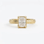 Front face-up view of a 3 carat radiant cut lab grown diamond engagement ring with a 14K yellow gold grooved band.