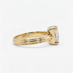 Side perspective of the grooved 14K yellow gold band highlighting the internal 14K gold authenticity stamp and 3ct radiant stone.