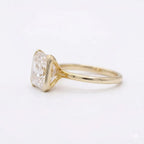 Side profile view of a 3 CT Asscher cut lab grown diamond engagement ring with open cathedral gallery.