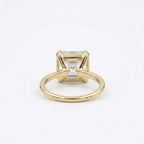 Undergallery view showing the secure corner bezel setting and slim band of a 3ct Asscher diamond ring.