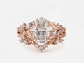 Top front view of a 3 carat oval lab diamond engagement ring set with floral leaf side clusters in 14k rose gold.