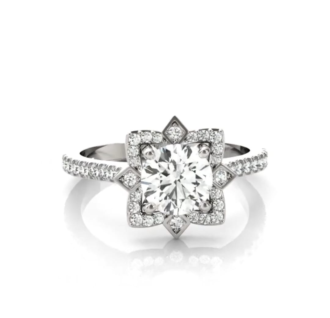 Front view of a 3 CT round cut lab grown diamond engagement ring with a star halo setting and pave band in white gold.