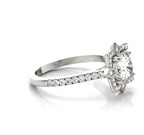 Side angle view of a 3 carat round lab diamond ring showing the pave band and star blossom halo setting.