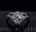 Angled front perspective of a white gold 2 CT Asscher cut lab grown diamond kite-set halo engagement ring.