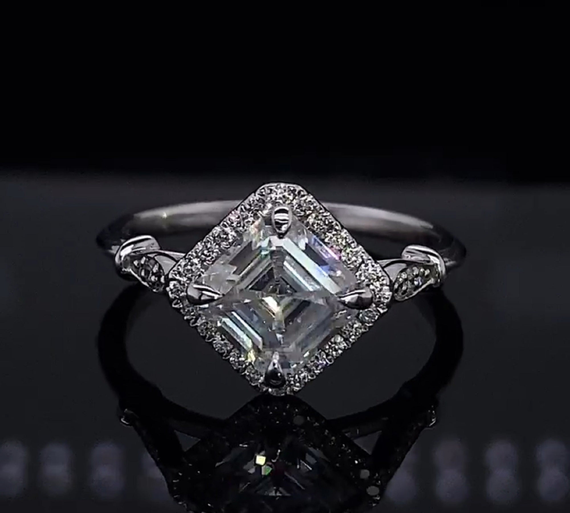 Angled front perspective of a white gold 2 CT Asscher cut lab grown diamond kite-set halo engagement ring.