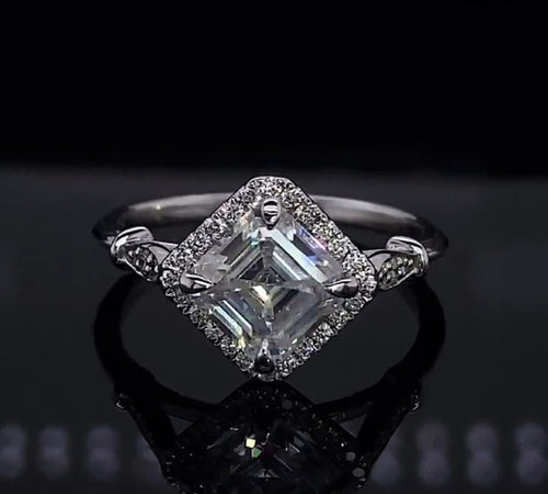 Angled front perspective of a white gold 2 CT Asscher cut lab grown diamond kite-set halo engagement ring.