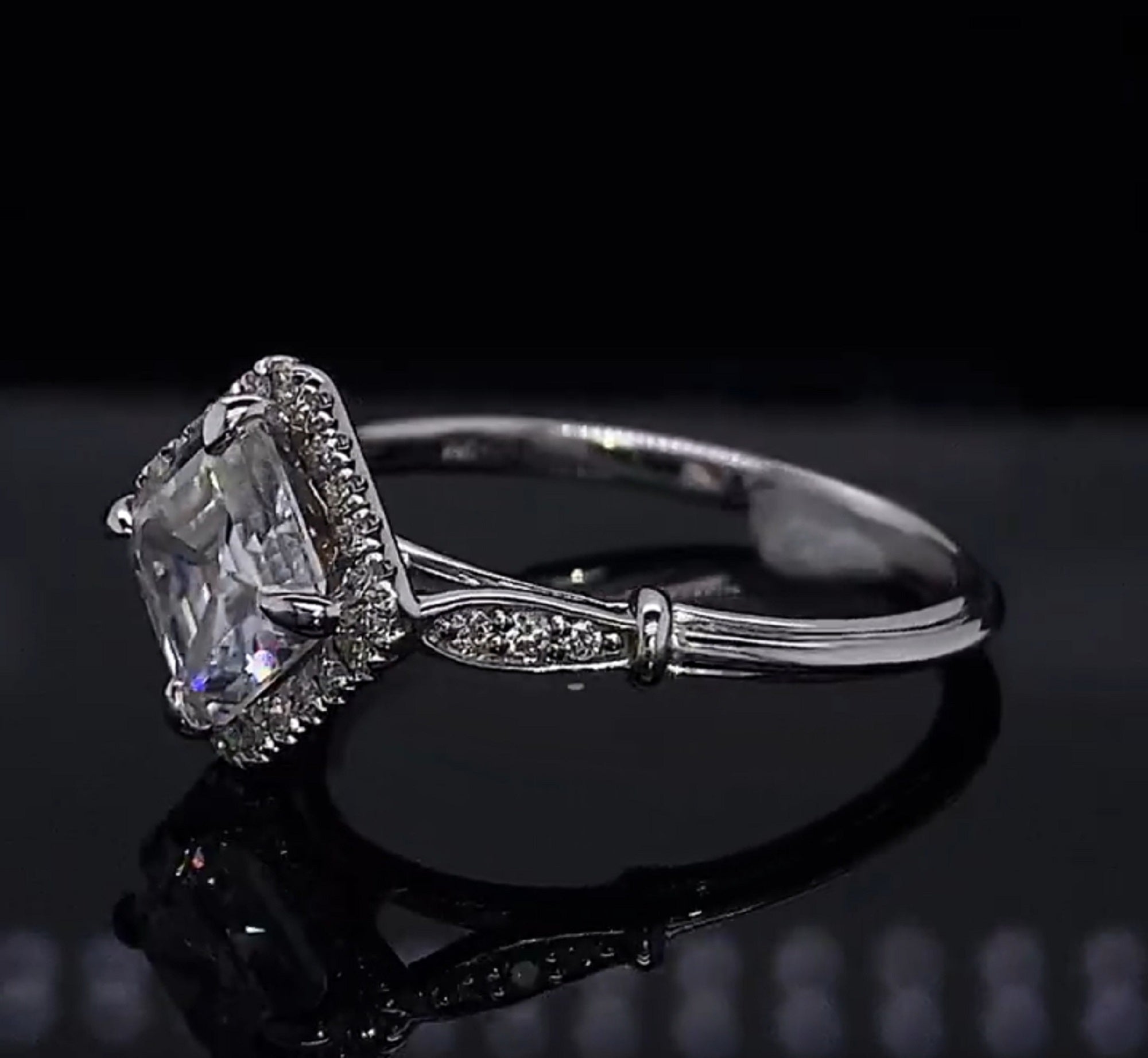 Side-angle shot displaying the vintage-inspired shoulder collar detail and micro-pavé accent diamonds on the white gold band.