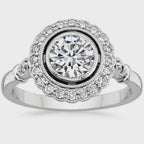 3 carat round cut lab grown diamond engagement ring featuring a milgrain bezel setting, scalloped halo, and detailed shoulders.