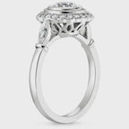 Side profile of a vintage lab grown diamond engagement ring displaying the openwork filigree under-gallery and diamond accent shoulders.