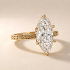 Macro angled view highlighting the 6-prong setting and detailed flower vine band of a 3 CT marquise lab diamond ring.
