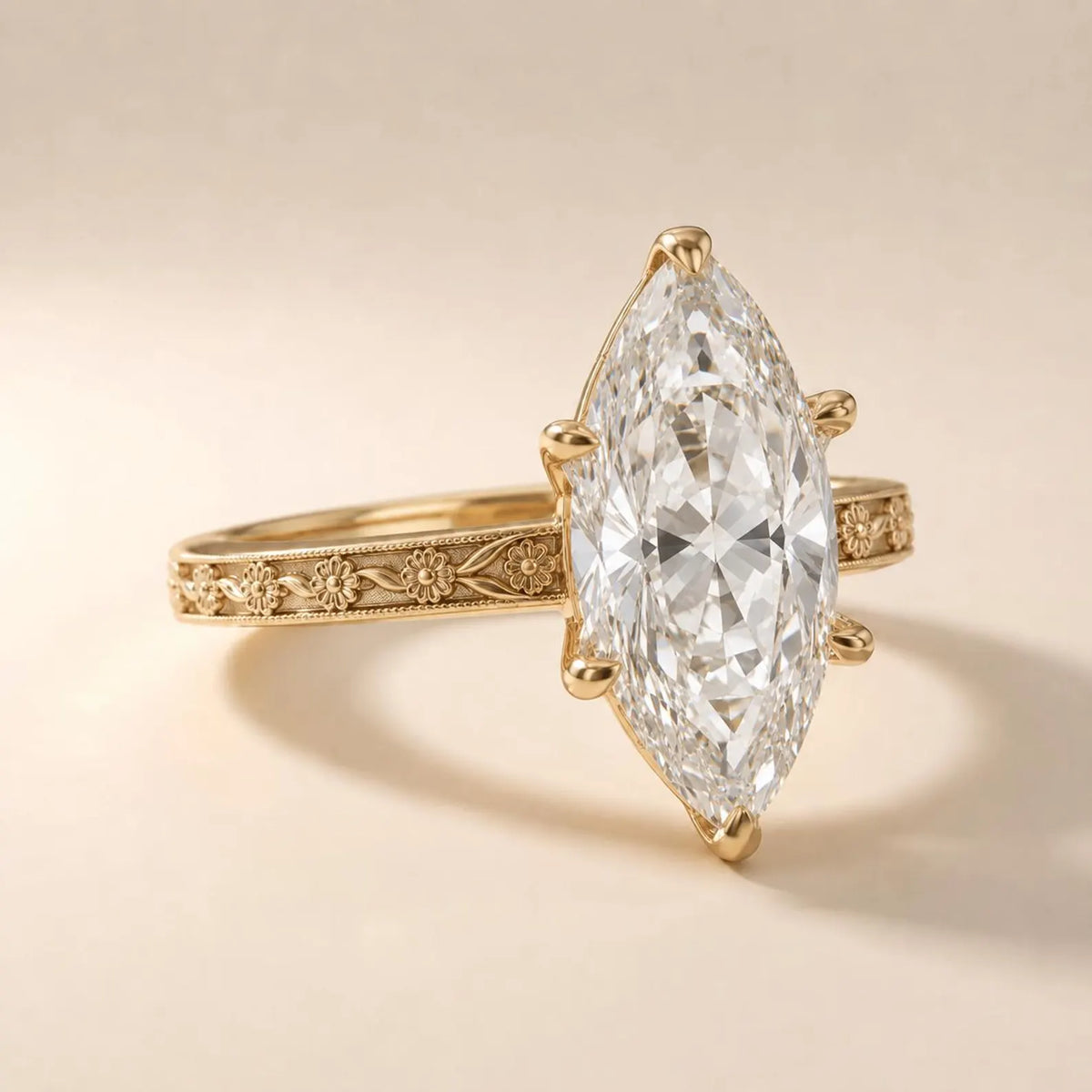 Macro angled view highlighting the 6-prong setting and detailed flower vine band of a 3 CT marquise lab diamond ring.