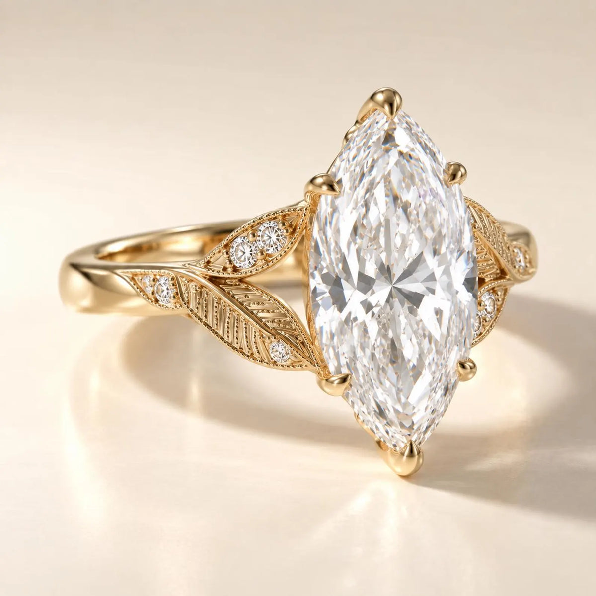 Angled view of a 4 CT marquise cut lab grown diamond engagement ring featuring leaf engraved split shoulders in yellow gold.