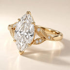 Close-up angled view highlighting the leaf texture, round diamond accents, and 6-prong setting of a 4 CT marquise diamond ring.