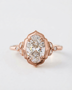 Top view of a 4 CT oval lab grown diamond vintage scalloped halo ring in rose gold.