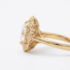 Side profile of a 4 CT cushion lab diamond vintage ring in yellow gold highlighting the detailed filigree under-gallery.