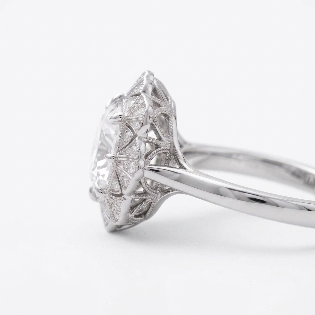 Profile view of a 4 CT cushion lab diamond ring in white gold showing the pierced filigree cathedral setting.