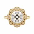 Overhead view of a 4 CT cushion cut lab grown diamond ring with a floral fan milgrain halo in yellow gold.