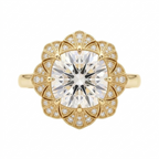 Overhead view of a 4 CT cushion cut lab grown diamond ring with a floral fan milgrain halo in yellow gold.