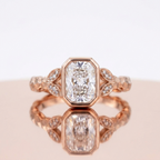 Front view of a 3 CT radiant cut lab grown diamond bezel ring with leaf accents in rose gold.