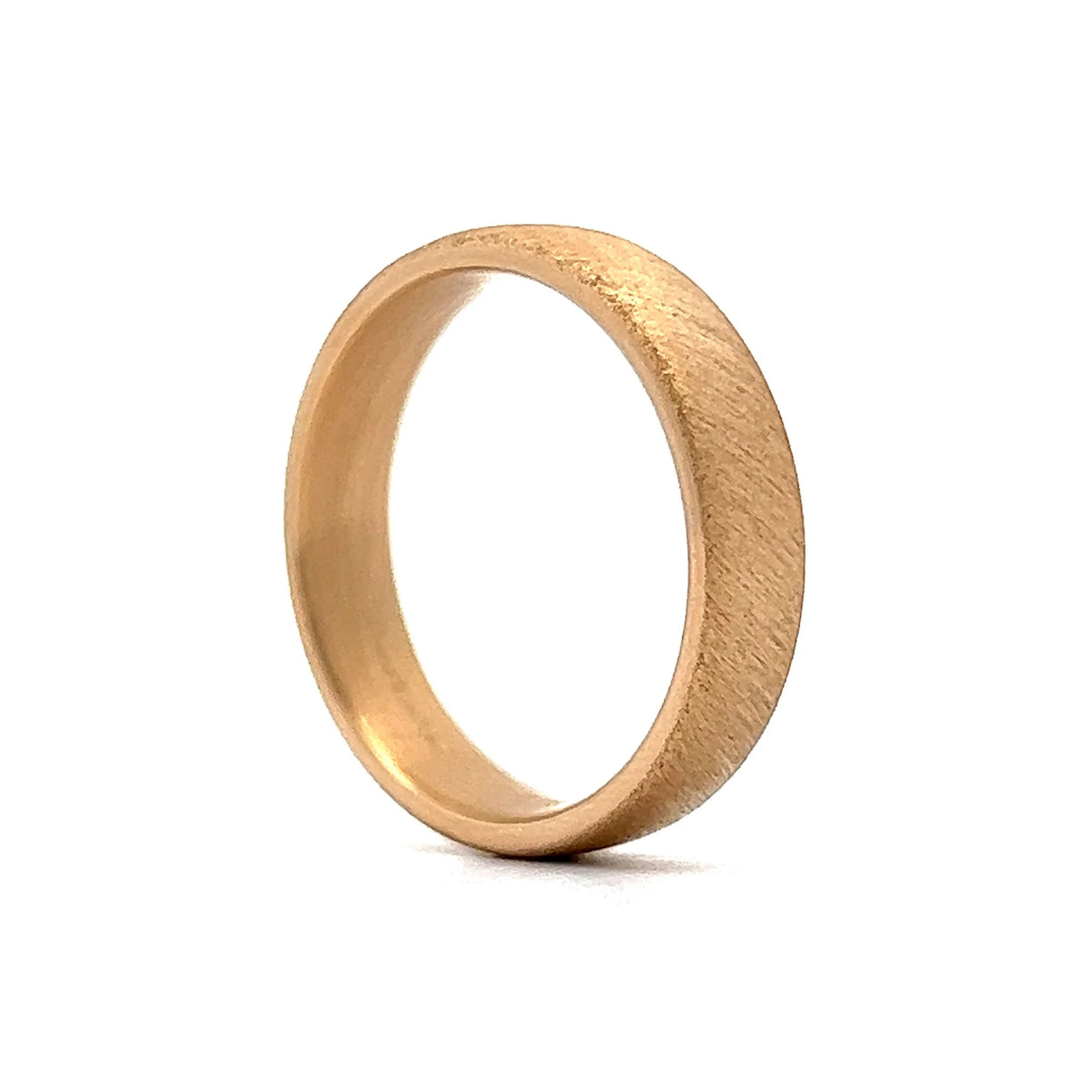 Men's gold wedding band with a coarse brushed scratch-texture matte finish displayed at an angle.