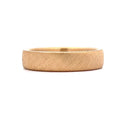 Front profile close-up view of a men's solid gold ring highlighting its diagonal wire-brushed surface texture.