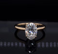 Direct top-down view of a 2 CT oval cut lab grown diamond engagement ring with a smooth gold band.