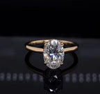 Direct top-down view of a 2 CT oval cut lab grown diamond engagement ring with a smooth gold band.