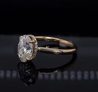 Three-quarter angled view of a 2 CT oval lab grown diamond engagement ring featuring a polished plain metal band.