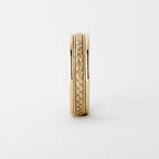 Vertical profile view displaying the intricate woven braid texture and polished outer edges of a men's gold band.