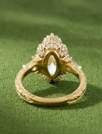 Undergallery view of a 4 CT marquise lab diamond setting displaying an ornate gold basket and micro-pavé accents.