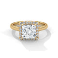 Top-down view of a 3 CT princess cut lab grown diamond engagement ring with a micro-pavé halo border set on a smooth yellow gold band.