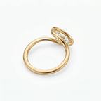 Side profile view of a modern 2 CT east-west oval lab diamond engagement ring showing the smooth bezel setting and rounded gold band.
