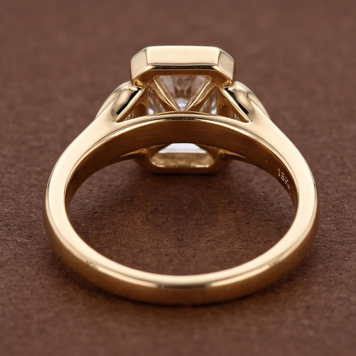 Undergallery side profile of a 5 CT radiant lab diamond ring displaying the 18K yellow gold band and open basket.