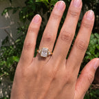 Full hand perspective of a 5 CT radiant cut lab grown diamond three-stone bezel ring in yellow gold.