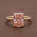 Front studio view of a 4 CT fancy pink radiant cut lab grown diamond ring set in 14K yellow gold.
