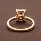 Undergallery view of a 4 CT pink radiant lab diamond ring showing the open basket setting and band profile.