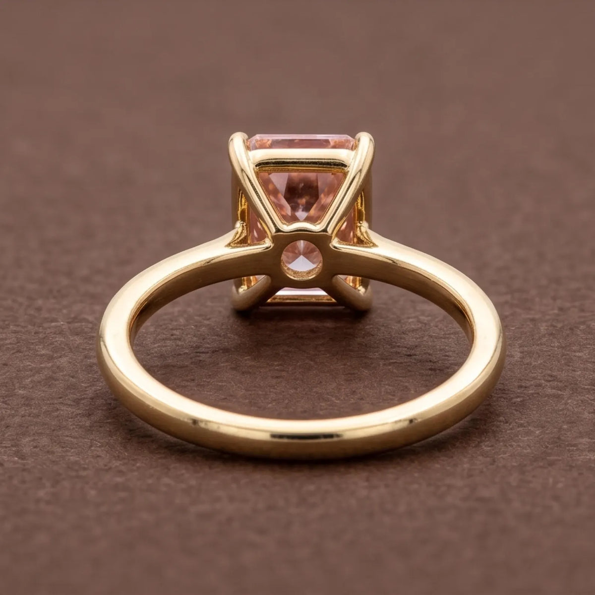 Undergallery view of a 4 CT pink radiant lab diamond ring showing the open basket setting and band profile.