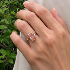On-finger perspective of a 4 CT fancy pink radiant cut lab grown diamond solitaire ring.