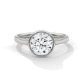 Top angle view of a 3 CT round cut lab grown diamond in a polished white gold bezel setting with diamond pavé rim.