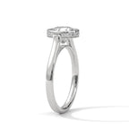 Angled side profile showing the pavé diamond collar rim around the bezel head and sleek white gold band.